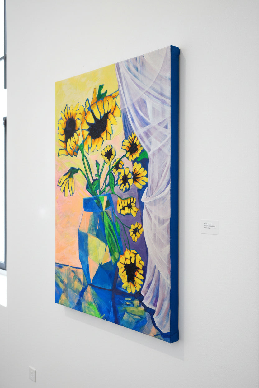 Painting of sunflowers in a blue vase on a white wall